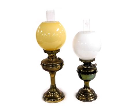 A brass oil lamp, with chimney and yellow glass shade, 58cm high, and a Duplex brass oil lamp, with glass chimney and white g