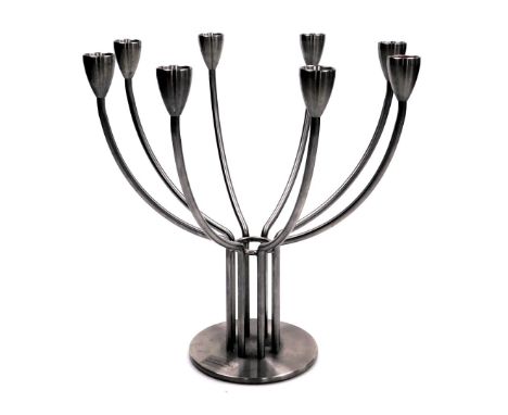 A K&amp;M Hagberg brushed stainless steel eight branch candelabrum, bears label, 33cm wide.