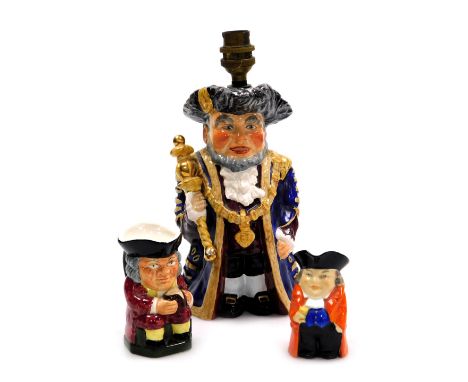 A Wedgewood and Company pottery character table lamp, modelled as Ye Olde Town Hall Lord Mayor, 26cm high, together with a Ro