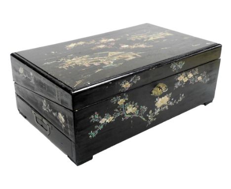 A Chinese black lacquer writing slope, decorated with mother of pearl and tortoise shell inlay in the form of buildings, flow
