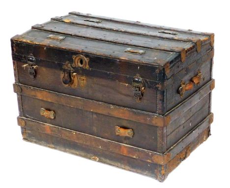 A late Victorian domed pine and canvas cabin trunk, with cast iron strap work, 58cm high, 87cm wide, 54cm deep.