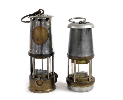 A miner's lamp, by the Wolf Safety Lamp Company (Wm Maurice) Limited of Sheffield, 17cm high, and a further miner's lamp, num