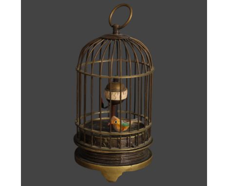 A small brass cased bird cage automaton clock, with bird, height 13cm.