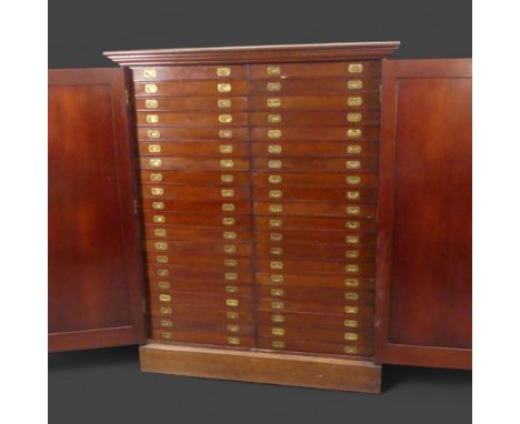 A fine Victorian mahogany floor standing specimen collectors cabinet, the fielded panelled cabinet doors opening to reveal 40