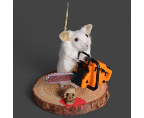 Taxidermy Mouse wielding a chainsaw An anthropomorphic full mount taxidermy mouse, mounted upright on a slice of wood. Holdin