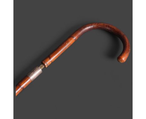 An early 20th century bamboo cased swordstick, with silver collar, blade length 66cm, overall length 83cm.