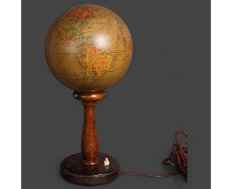 A 1920's 'Geographia', 8 inch, terrestrial revolving globe lamp on beechwood stand, height 42cm.