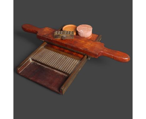 An antique apothecary pill roller, by Mawson, Son &amp; Son's, with makers label, accompanied by a terracotta pot with lid, w