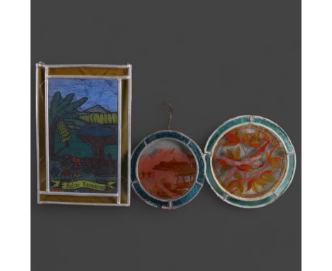 A group of stained glass panels, including an oval glass panel  depicting farmyard mountain scene, diameter 20cm, a second ov