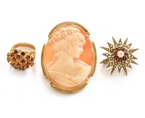 A garnet cluster ring, stamped '9CT', finger size M; a 9 carat gold garnet and split pearl brooch, length 3.3cm; and a cameo 