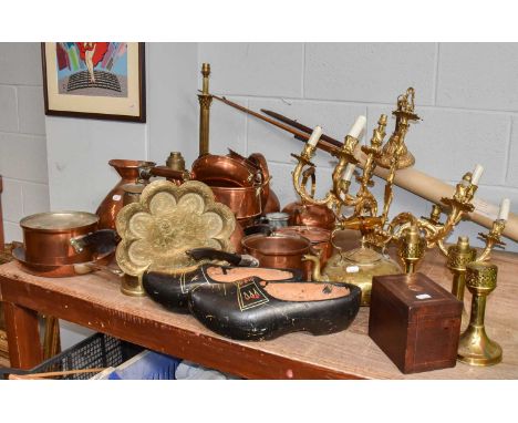 A large quantity of assorted Victorian and later copper and brass items, including: measuring flagons, a twelve light chandel