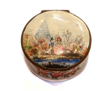 An 18th century circular enamel box with hinged cover, painted with a courting scene in a river landscape with an obelisk (a/