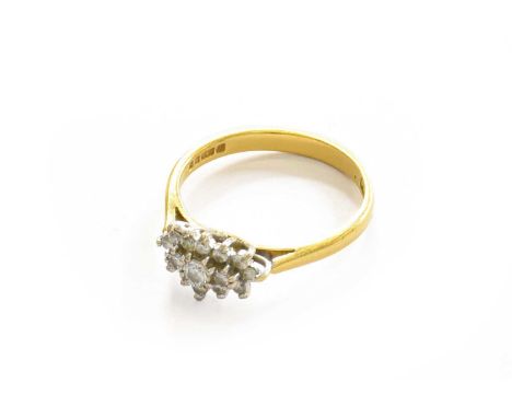 An 18 carat gold diamond cluster ring, finger size OThe ring is in good condition. The approximate qualities of the diamonds 