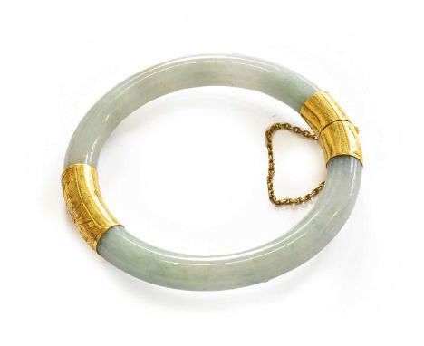A jade hinged bangle, two sections of jade joined by yellow textured caps, inner measurements 5.2cm by 5.2cmOne of textured c