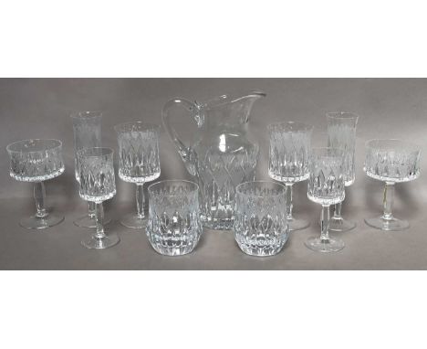 A comprehensive part suite of glassware, probably Continental, comprising 12 red wines, 12 white wines, 10 champagne flutes, 