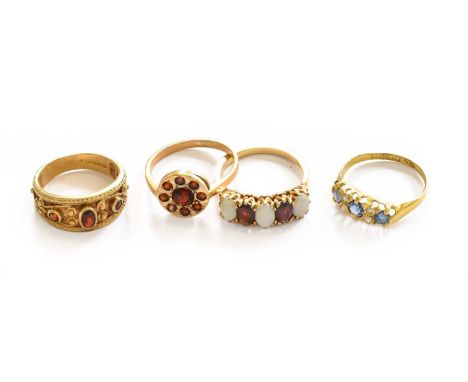A 9 carat gold garnet cluster ring, finger size O1/2 (marks rubbed); a 9 carat gold garnet and opal five stone ring, finger s
