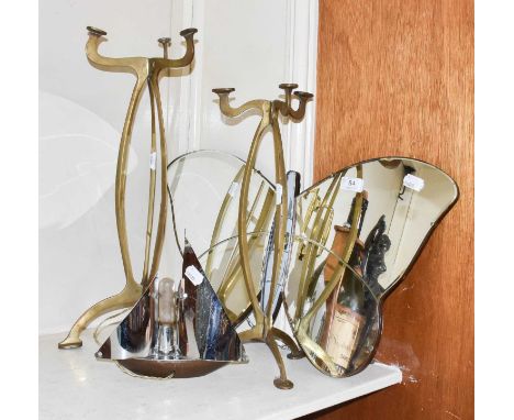 A pair of Art Nouveau brass hat stands, an Art Deco butterfly mirror, and a chrome ship-formed table lampMirror, two retainin