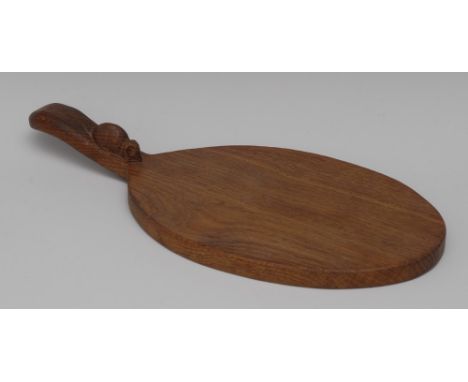 Robert Thompson, Mouseman of Kilburn, an oval paddle shaped cheese board, the single handle carved with typical signature mou