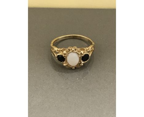 9CT YELLOW GOLD OPAL AND BLACK SAPPHIRE RING