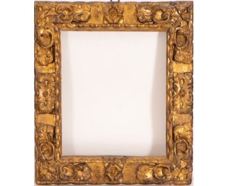 In carved and gilded wood. Exterior measurements: 75 X 71, light measurements: 53 X 50