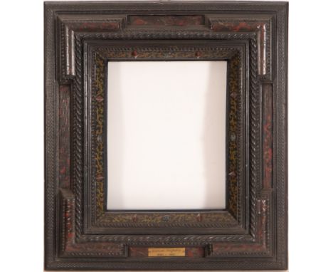 In carved and gilded wood. Exterior measurements: 68 x 59, light measurements: 49 x 40