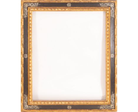 In carved, ebonized and gilded wood. Exterior measurements: 114 x 98 light measurements: 91 x 75