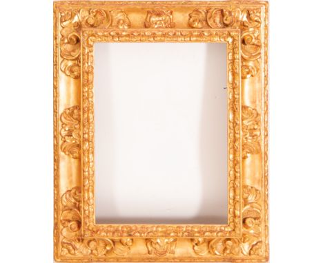 In carved and gilded wood. Exterior measurements: 76 X 62, light measurements: 54 X 40