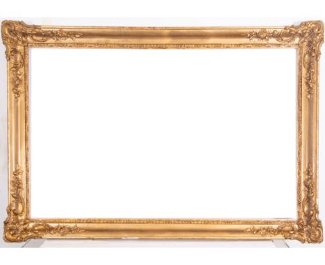 In molding and gilded wood. Exterior measurements: 185 x 125, light measurements: 166 x 106
