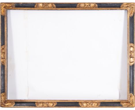 In ebonized and gilt wood. Exterior measurements: 191 x 148, light measurements: 169 x 125