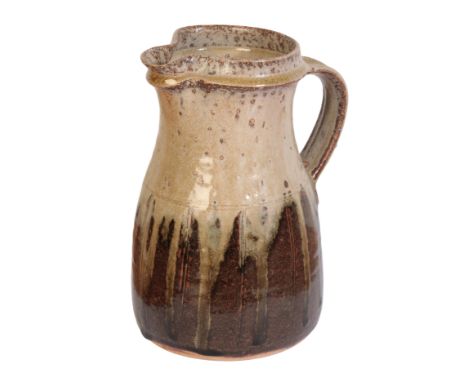 *RICHARD BATTERHAM (1936-2021): A STONEWARE JUGwith green ash drip glaze over brown glaze, unsigned, 22cm high