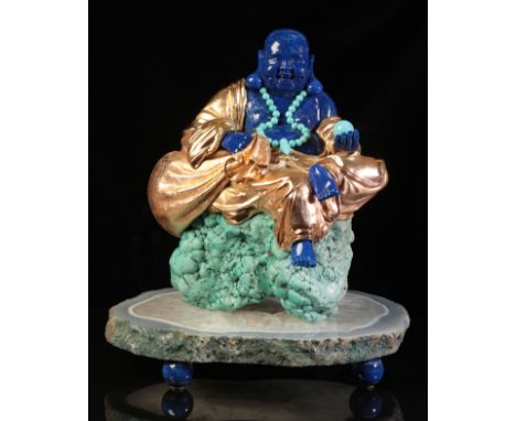 LUIS ALBERTO QUISPE APARICIO (20TH CENTURY): A LAPIS LAZULI FIGURE OF BUDDHA modelled seated on a turquoise pebble, highlight