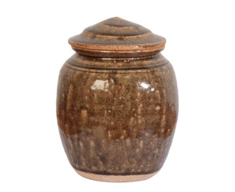 *RICHARD BATTERHAM (1936-2021): A STONEWARE JAR AND COVERwith all-over dark green ash glaze, unsigned, 19cm high