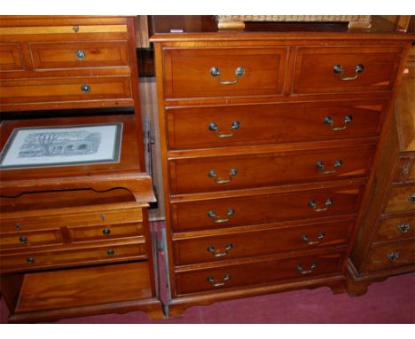 A reproduction yew wood squarefront chest of two short over five long drawers, together with a pair of reproduction yew wood 