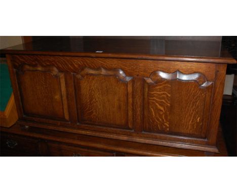 A 17th century style joined oak hinge top three panel blanket box Condition Report / Extra Information Height 51cm, width 122
