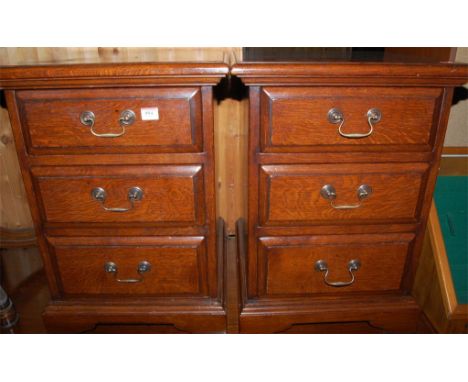 A pair of joined oak three drawer bedside chests Condition Report / Extra Information Height 63.5cm, width 45.5cm, depth 45cm