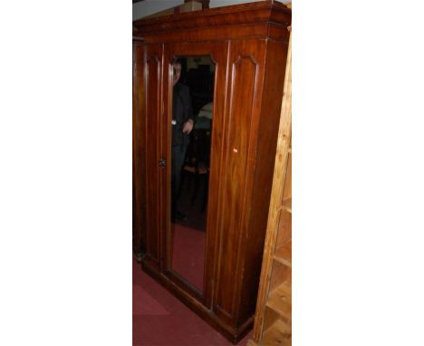 A Victorian mahogany single mirror door wardrobe