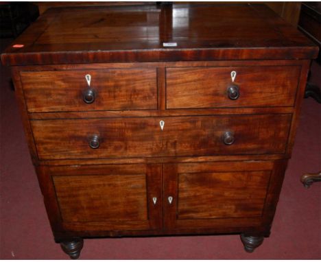 An early 19th century mahogany and ebony strung hinge top commode in the form of a chest
