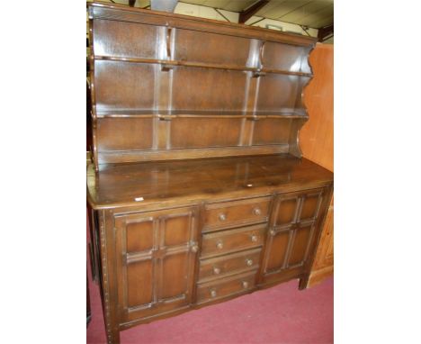 An Ercol dark elm dresser