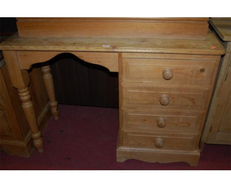 A modern pine single pedestal kneehole writing desk