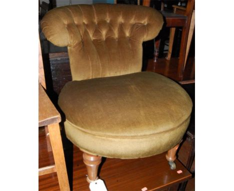 A Victorian walnut framed and green button backed upholstered nursing chair
