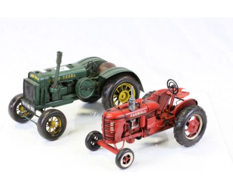 Two Tinplate Tractor models, one marked "John Deere", the other "Farmall"