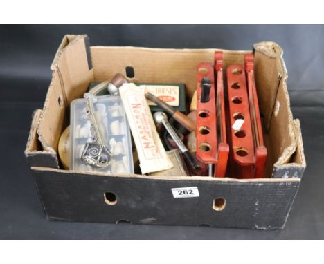 A collection of vintage pipes and pipe racks