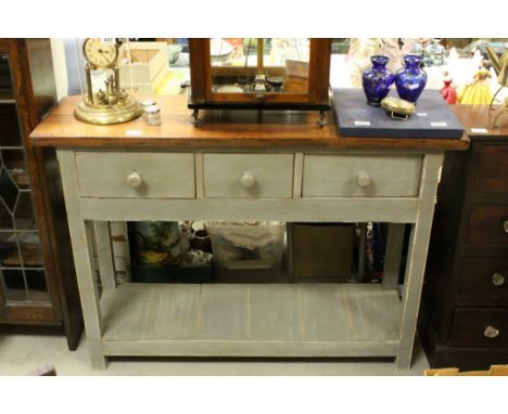 Fruitwood & pine work table with three drawers & pot shelf below