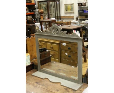 Carved wall mirror with shelf below