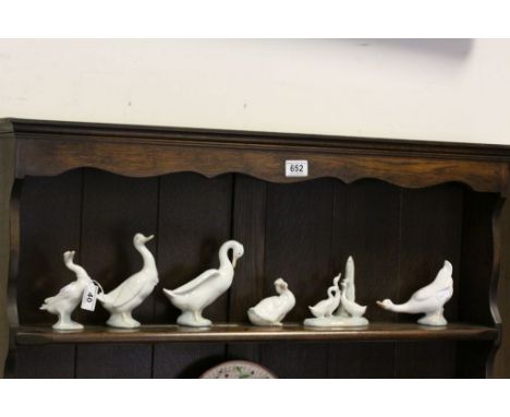 Five Nao ceramic models of Geese and a Lladro example numbered 15 to base