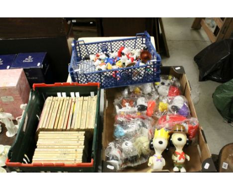Collection of vintage Snoopy figures and Charlie Brown books