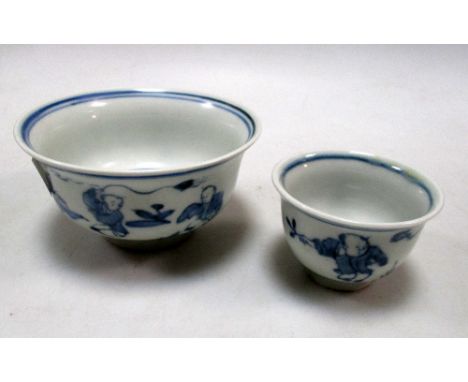 Two blue and white teabowls, period of Tianqi, both exteriors painted with children playing, 10cm (4 in) and 6cm (2.25 in) di
