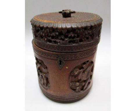 A 19th century bamboo tea caddy, the cylindrical body carved with alternating relief panels of figures and of phoenix, the to