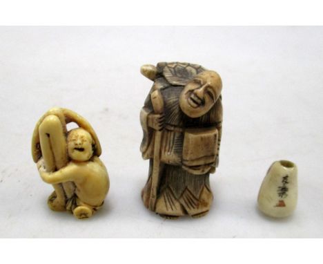 A bone netsuke, Daruma ojime and another part Ashinaga-Tenaga netsuke, the first of man travelling with a minogame on his sho