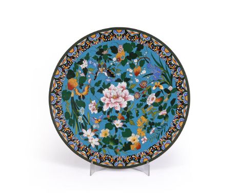 A Large Japanese Cloisonné Enamel Dish, of circular form resting on a short foot, decorated on a light blue ground with butte